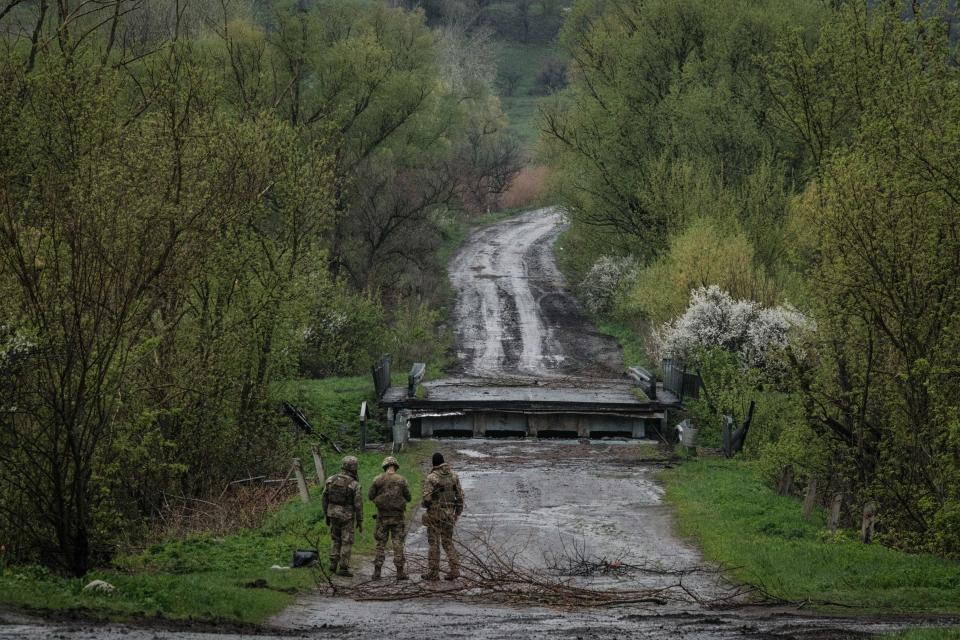 Ukrainian soldiers, pictured here standing on a road near Lyman in eastern Ukraine.