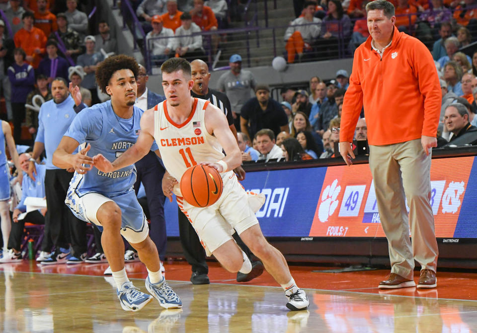 Jan 6, 2024; Clemson, South Carolina, USA; Clemson graduate Joseph Girard III dribbles near University of North Carolina guard Seth Trimble (7) during the second half at Littlejohn Coliseum. Mandatory Credit: Ken Ruinard-USA TODAY Sports