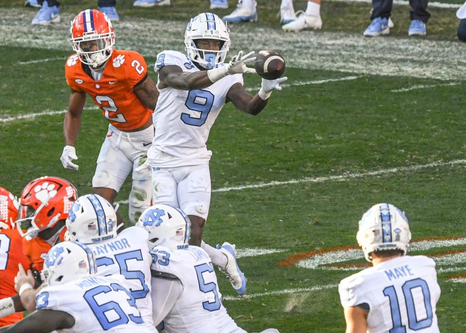 Nov 18, 2023; Clemson, South Carolina, USA; North Carolina Tar Heels wide receiver Devontez Walker (9) catches a ball near Clemson Tigers cornerback Nate Wiggins (2) during the first quarter at Memorial Stadium. Mandatory Credit: Ken Ruinard-USA TODAY Sports