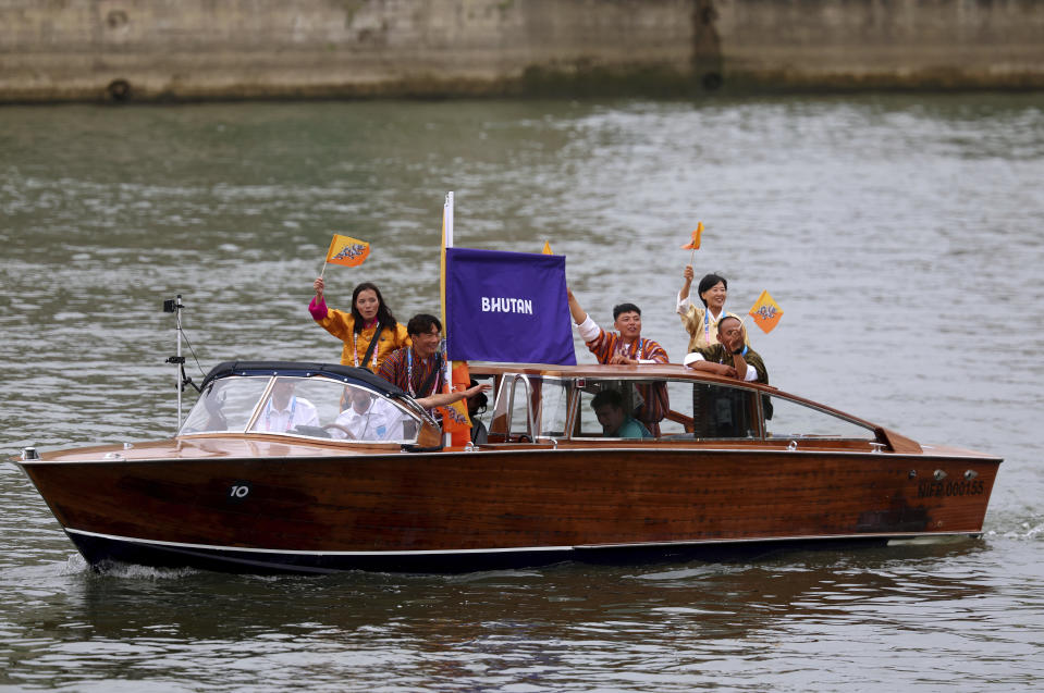 Bhutan's team during the athletes' parade at the Seine, in Paris, France, during the opening ceremony of the 2024 Summer Olympics, Friday, July 26, 2024. / Credit: Michael Reaves / AP