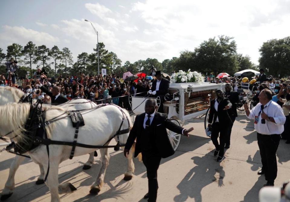 The horse-drawn carriage carrying the body of George Floyd.