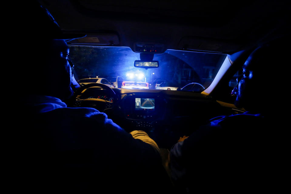 Taqi Thomas, right, patrols the streets with another member of Cure Violence in Chicago on May 22, 2019. (Martha Irvine / AP file)