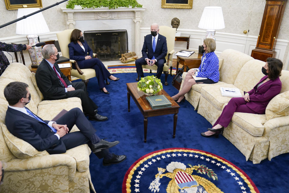 President Joe Biden speaks during a meeting in the Oval Office of the White House, Thursday, May 13, 2021, in Washington. From left, Secretary of Transportation Secretary Pete Buttigieg, Sen. Mike Crapo, R-Idaho, Vice President Kamala Harris, Biden, Sen. Shelley Moore Capito, R-W.Va., and Commerce Secretary Gina Raimondo. (AP Photo/Evan Vucci)