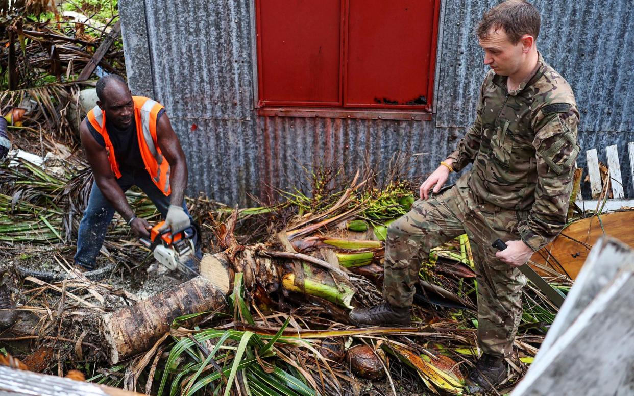 The British military and civilians work together to clear debris caused by Hurricane Irma before Hurricane Maria arrives at Tortola, British Virgin Islands - BRITISH MINISTRY OF DEFENCE