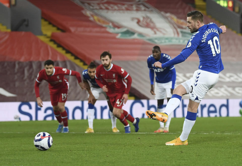 Everton's Gylfi Sigurdsson scores his sides 2nd goal from the penalty spot during the English Premier League soccer match between Liverpool and Everton at Anfield in Liverpool, England, Saturday, Feb. 20, 2021. (Lawrence Griffiths/ Pool via AP)