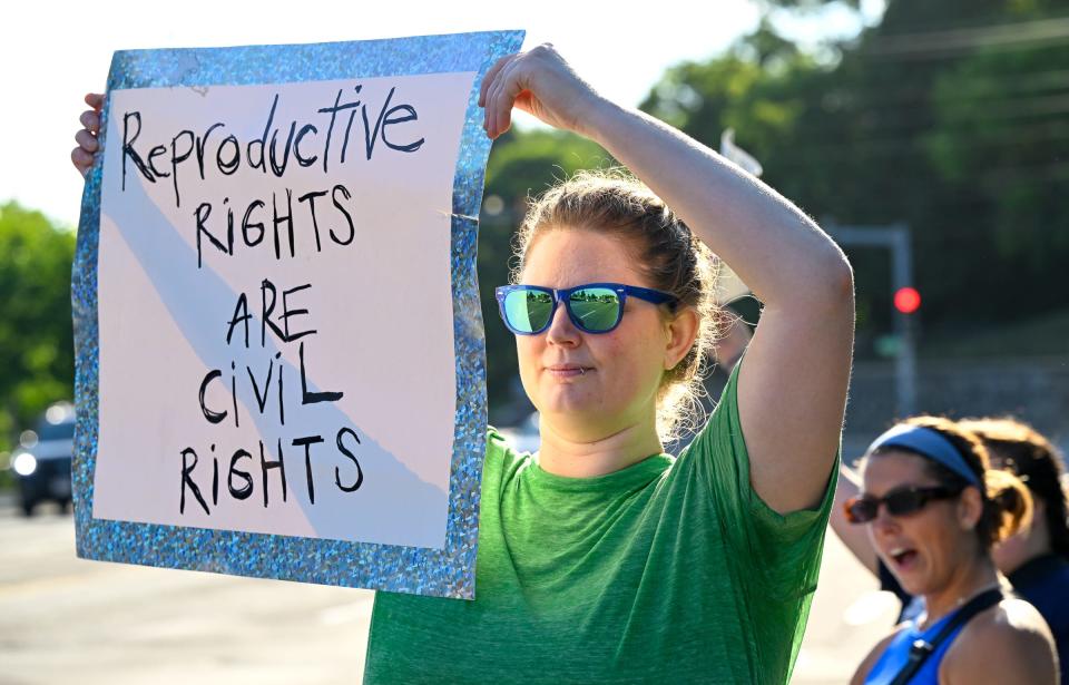 Abortion rights activist Midge Lyon, of Salem, holds up a sign during a rally outside the Cummings Center in Beverly on Friday, June 24, 2022. The United States Supreme Court overturned Roe v. Wade and the constitutional right to an abortion by a 6-3 ruling by the U.S. Supreme Court justices.