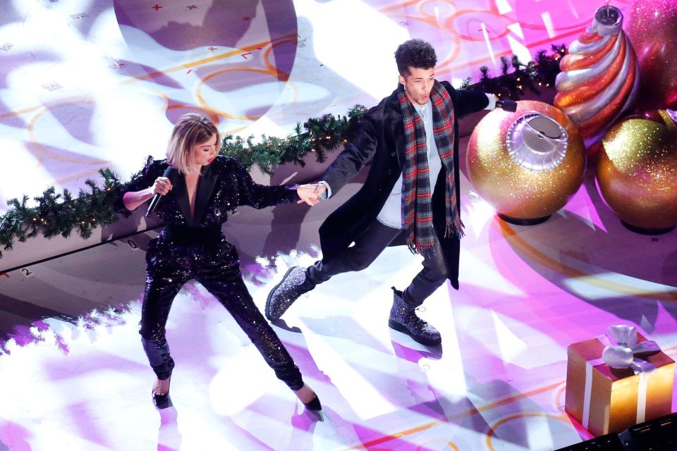 Jordan Fisher and Julianne Hough perform onstage at the 87th Annual Rockefeller Center Christmas Tree Lighting Ceremony on December 04, 2019 in New York City.