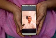 The Wider Image: Indians share the stories of loved ones they lost to the pandemic