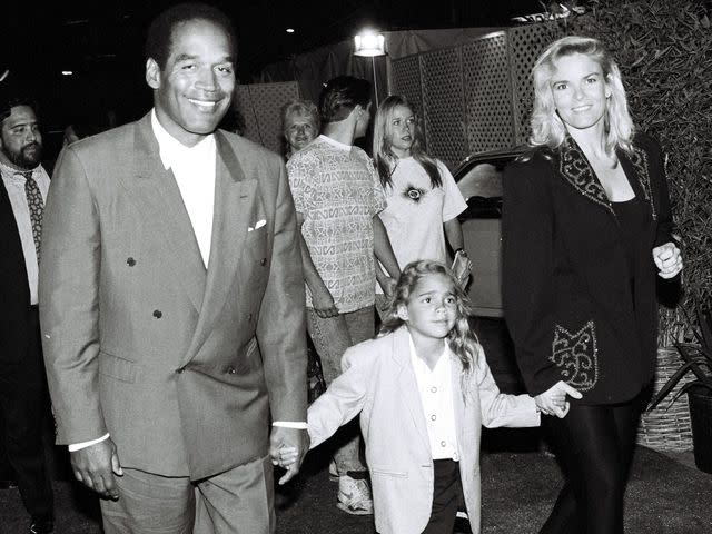 <p>Bei/Shutterstock</p> OJ Simpson, Nicole Simpson and daughter Sydney Simpson at the 'Naked Gun 2 1/2' Premiere on June 27, 1991.