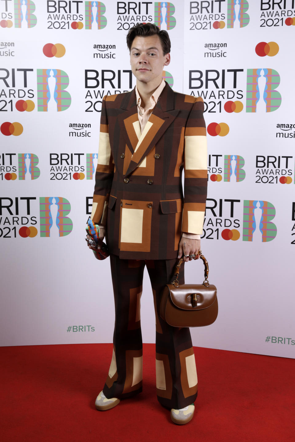 Harry Styles wins the Mastercard British Single award for Watermelon Sugar during The BRIT Awards 2021 at The O2 Arena on May 11, 2021 in London, England.