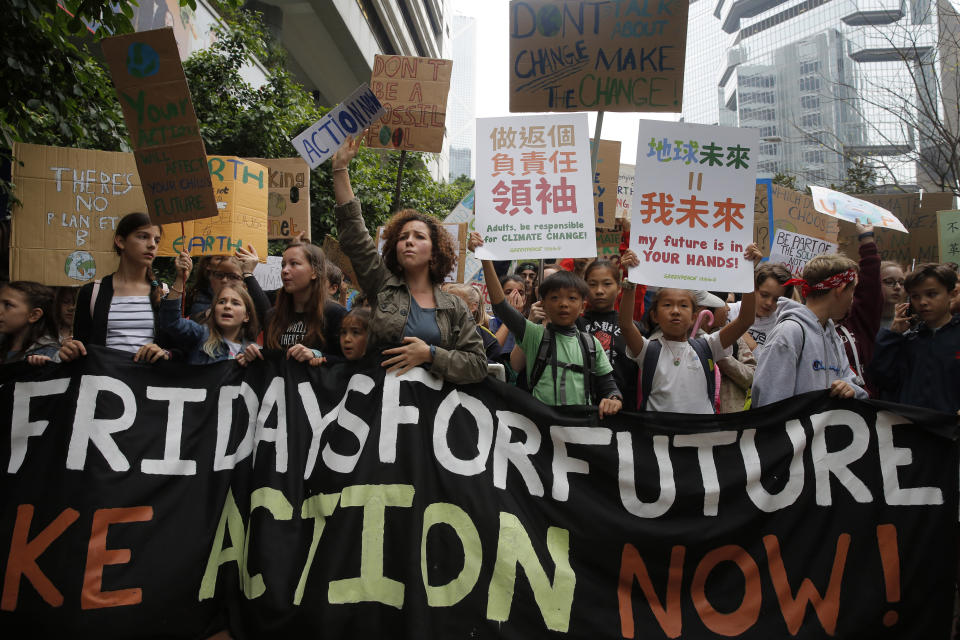 Hundreds of schoolchildren take part in a climate protest in Hong Kong, Friday, March 15, 2019. Students in more than 80 countries and territories worldwide plan to skip class Friday in protest over their governments' failure to act against global warming. The coordinated 'school strike' was inspired by 16-year-old activist Greta Thunberg, who began holding solitary demonstrations outside the Swedish parliament last year. (AP Photo/Kin Cheung)