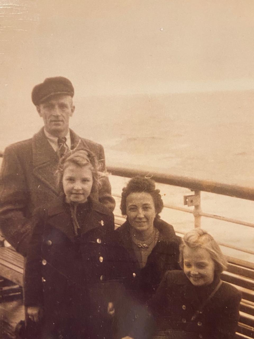 <div class="inline-image__caption"><p>Anita with her sister, Kate, and parents, coming to America in 1949. </p></div> <div class="inline-image__credit">Courtesy Thomas Family</div>