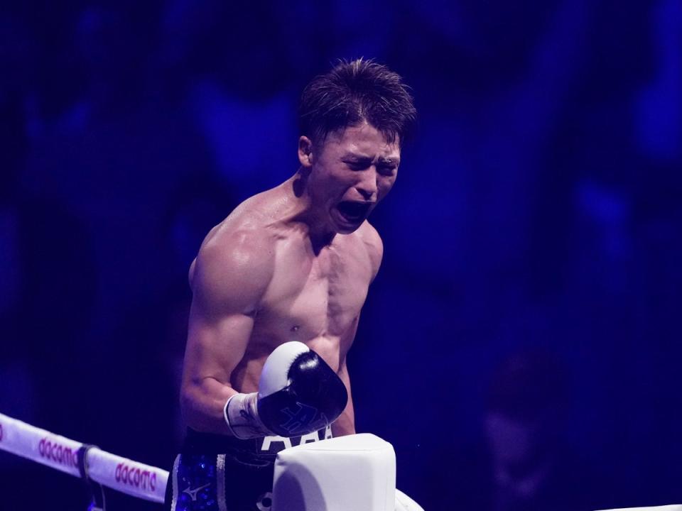 Naoya Inoue celebrates stopping Stephen Fulton to take his super-bantamweight belts (AP)