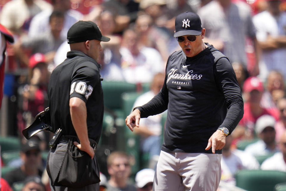 New York Yankees manager Aaron Boone argues after being ejected by home plate umpire Dan Merzel, left, during the third inning of a baseball game against the St. Louis Cardinals Sunday, July 2, 2023, in St. Louis. (AP Photo/Jeff Roberson)