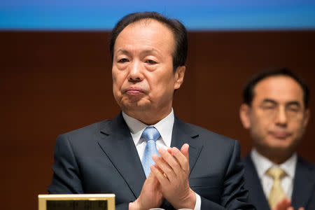 Shin Jong-Hyun, co-vice chairman of Samsung Electronics Co., claps during the company's annual general meeting at the company's Seocho office building in Seoul, South Korea, March 23, 2018. SeongJoon Cho/Pool via Reuters