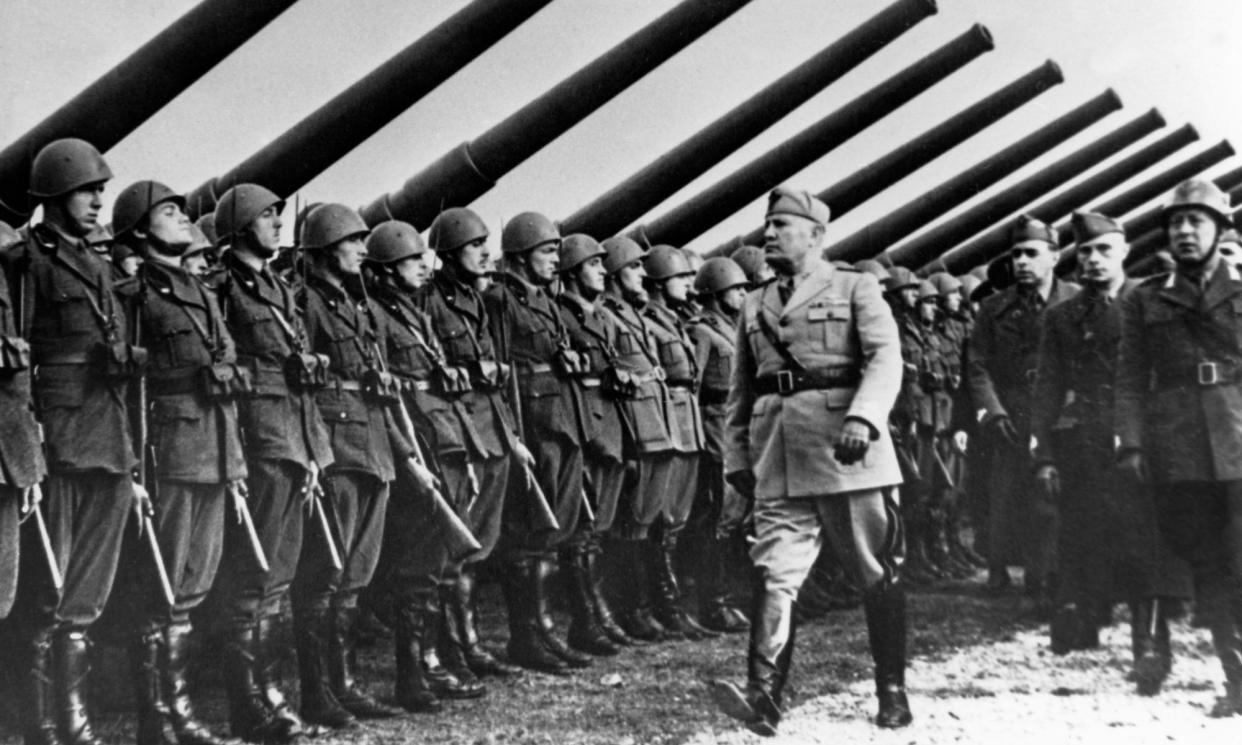 <span>Benito Mussolini leading an inspection of his troops in 1940. Most of Italy’s municipalities proclaimed him an honorary citizen under orders from fascist authorities during the rise of his regime.</span><span>Photograph: ullstein bild/Getty Images</span>