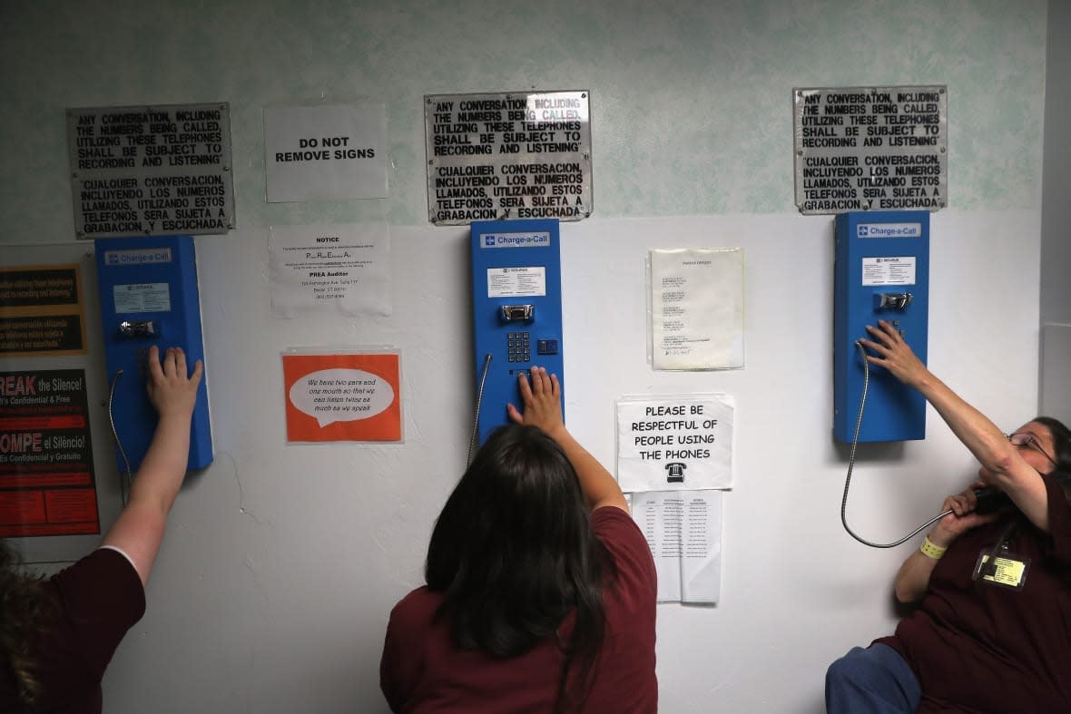 Prison inmates make one of their daily allotment of six phone calls at the York Community Reintegration Center on May 24, 2016 in Niantic, Connecticut. (Photo by John Moore/Getty Images)