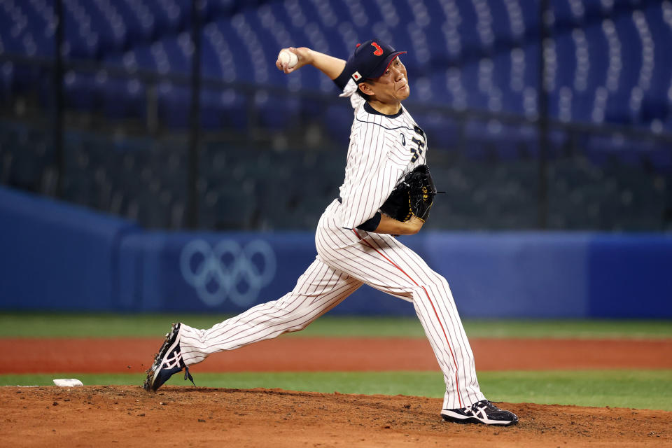 <p>YOKOHAMA, JAPAN - AUGUST 02: Yudai Ohno #22 of Team Japan pitches in the ninth inning against Team United States during the knockout stage of men's baseball on day ten of the Tokyo 2020 Olympic Games at Yokohama Baseball Stadium on August 02, 2021 in Yokohama, Kanagawa, Japan. (Photo by Yuichi Masuda/Getty Images)</p> 