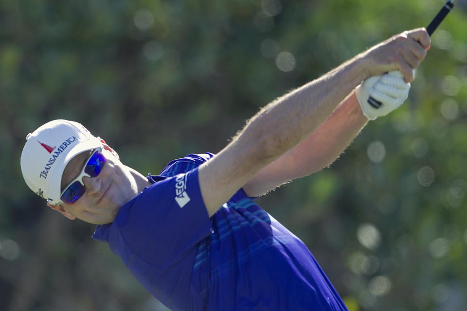 Zach Johnson drives off the first tee during the final round of the Tournament of Champions golf tournament, Monday, Jan. 6, 2014, in Kapalua, Hawaii. (AP Photo/Marco Garcia)