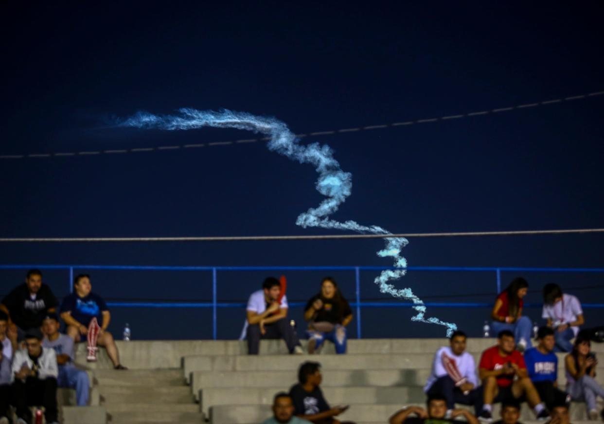 A rocket launch from Vandenberg Space Force Base is seen from Indio High School during their football game in Indio, Calif., Thursday, Sept. 14, 2023.