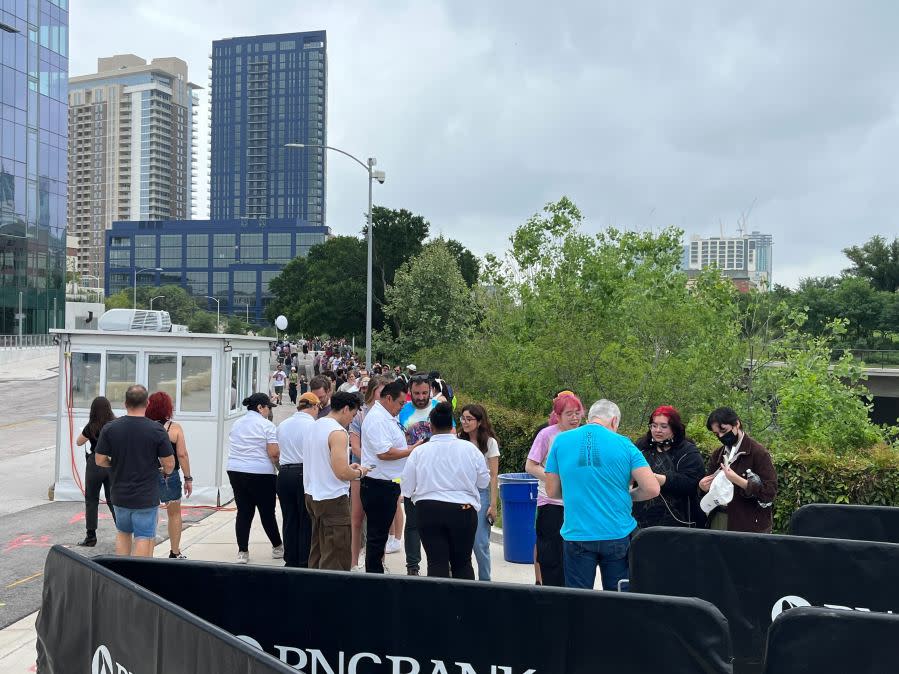 Folks line up to see an eclipse performance from Vampire Weekend at Moody Amphitheater in Austin, Texas. (KXAN Photo/Avery Travis)