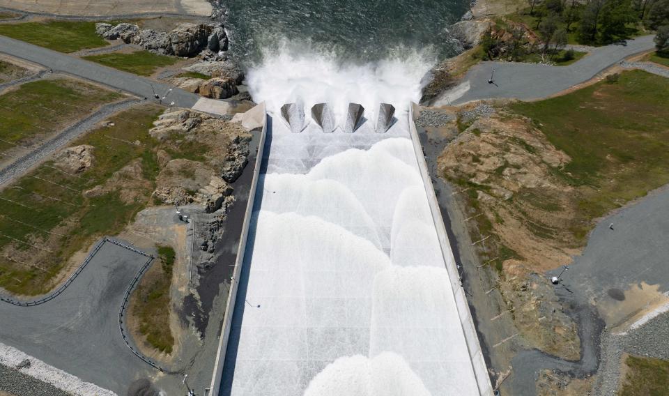 In this aerial photo, water is released from Lake Oroville down a spillway in Oroville, California, on April 16, 2023. A very wet winter has left California's reservoirs looking healthier than they have for years, as near-record rainfall put a big dent in a lengthy drought.