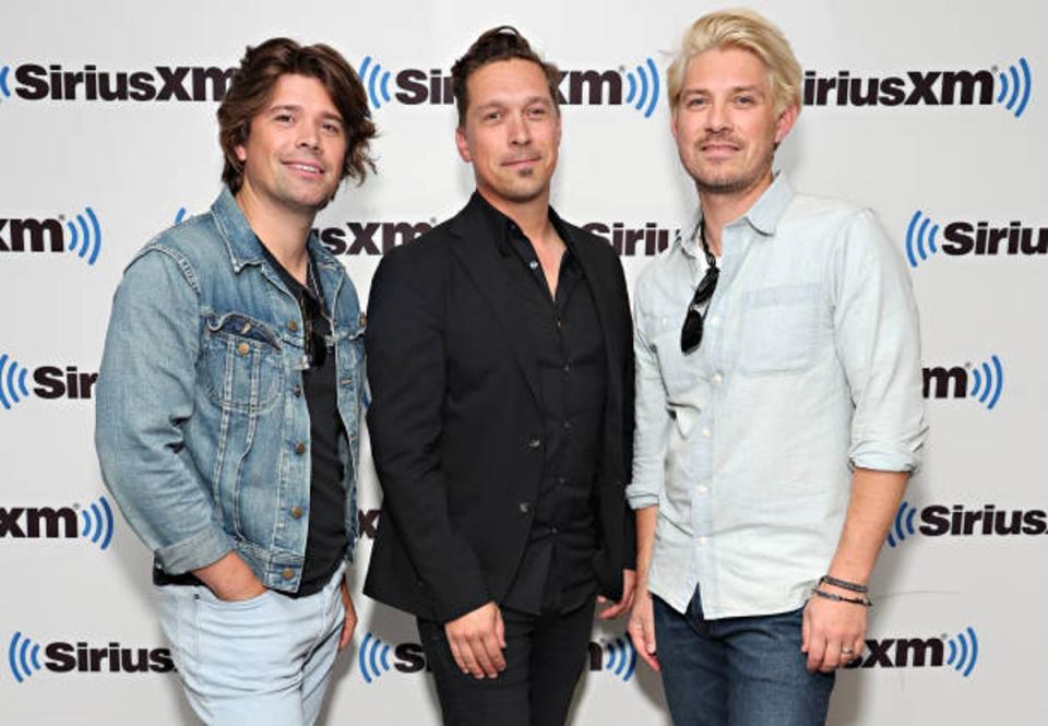 Boyband Hanson appeared at the Erinsborough Music Festival in 2019. (Getty Images)