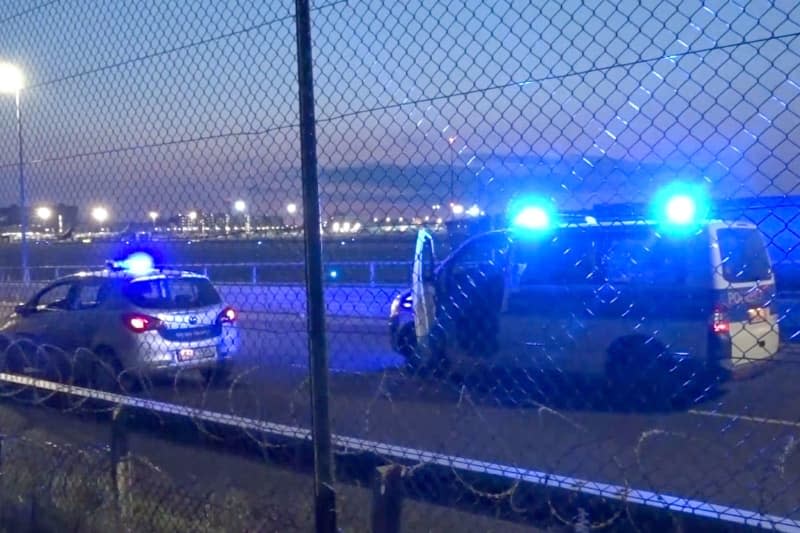 Police vehicles are parked on the tarmac at Frankfurt Airport. Air traffic has been temporarily halted due to a climate activist campaign. Mike Seeboth/TNN/dpa