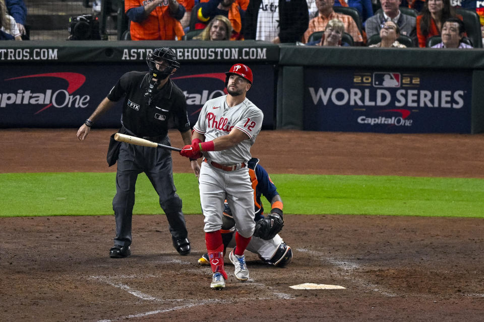 Oct 29, 2022;  Houston, Texas, USA;  Philadelphia Phillies left fielder Kyle Schwarber (12) and home plate umpire Pat Hoberg watch as a ball hit by Schwarber goes foul during the eighth inning during game two of the 2022 World Series at Minute Maid Park.  Mandatory Credit: Jerome Miron-USA TODAY Sports