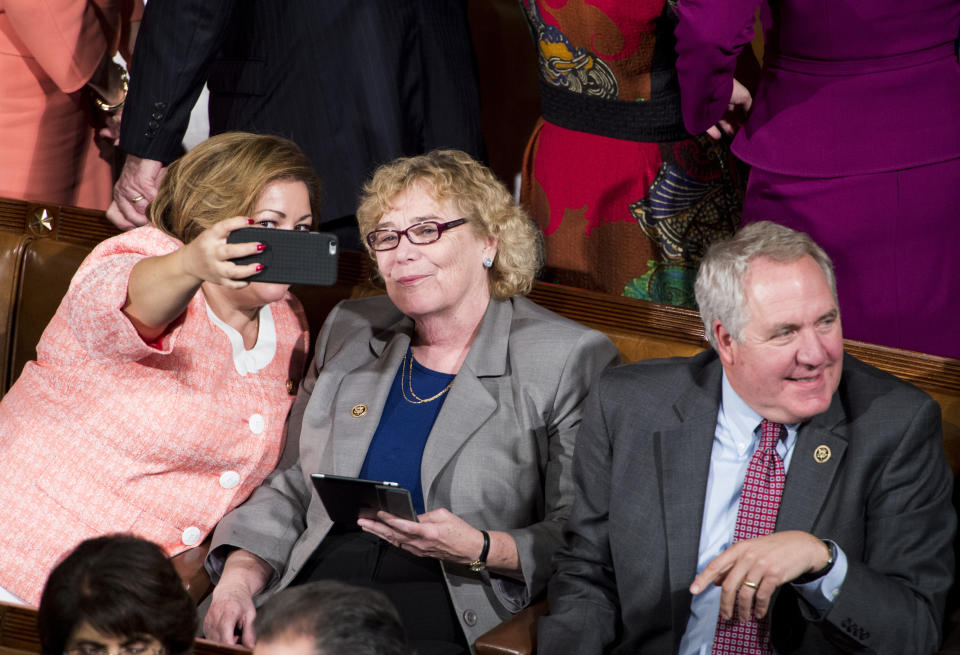 Rep. Linda Sanchez (D-Calif.) takes a selfie with Rep. Zoe Lofgren (D-Calif.) as Rep. John Shimkus (R-Ill.) sits nearby before President Barack Obama's State of the Union address on Jan. 20, 2015.
