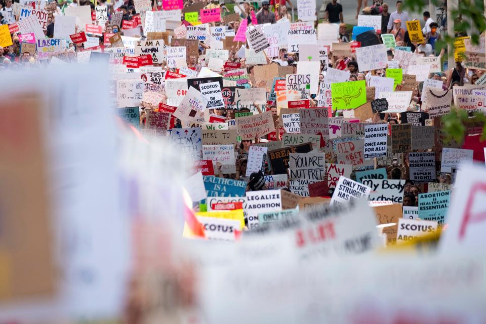 People march in Atlanta on June 24, 2022, to protest the Supreme Court's decision to overturn Roe v. Wade.