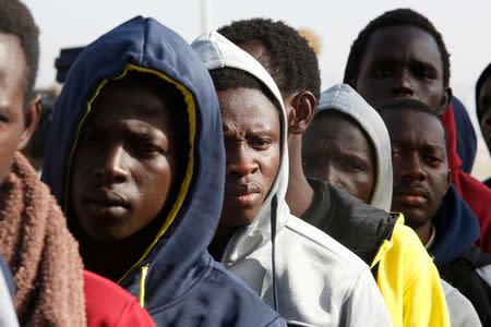 Gambian migrants deported from Libya stand in line as they wait for registration at the airport in Banjul, Gambia April 4, 2017. REUTERS/Luc Gnago