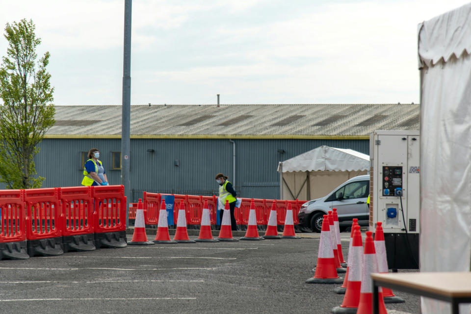 A coronavirus testing drive through centre set up at Cardiff City Stadium, Wales to test people with the virus symptoms and help fight against the spread of Covid-19. April 16, 2020. See SWNS story SWOCtest. Eerie pictures show the quiet reality at a coronavirus test centre - with only a THIRD of bays open. Pictures taken from inside a car at the test centre show few are being tested, with only two of the six bays open. Cardiff City Stadium holds Walesâ first drive-through coronavirus test centre - part of the Welsh government's plan for residents to be tested within 30 minutes of their home. However these pictures follow reports that Walesâ health minister Vaughan Gething is concerned the countryâs full testing capacity is not being met. 