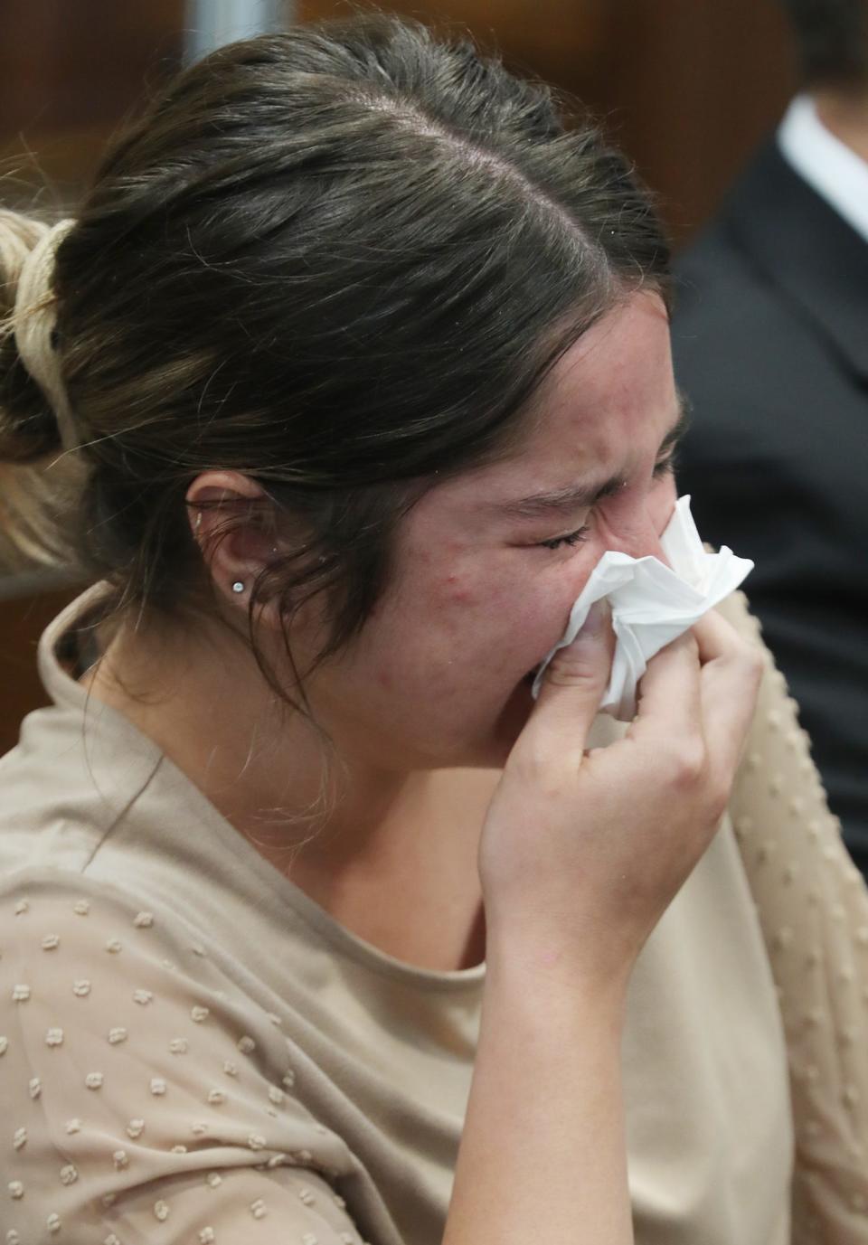 Sydney Powell sobs during a recent pretrial in Summit County Common Pleas Court. She is charged with murder in the stabbing death of her mother, Brenda, in March 2020.