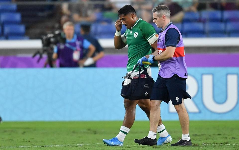 Bundee Aki of Ireland leaves the pitch for a head injury assessment during the 2019 Rugby World Cup match between Ireland and Scotland - GETTY IMAGES