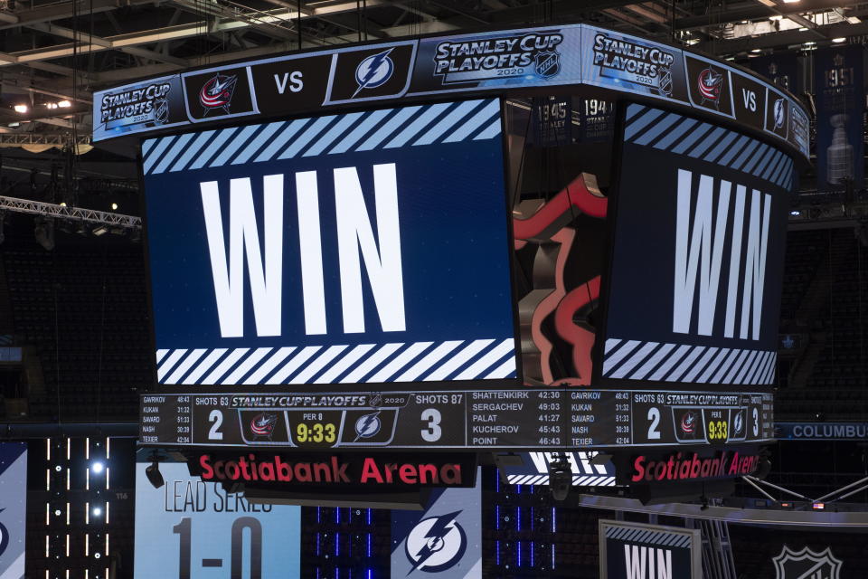 The scoreboard is shown after the Tampa Bay Lightning defeated the Columbus Blue Jackets in five overtimes in Game 1 of an NHL hockey Stanley Cup first-round playoff series, Tuesday, Aug. 11, 2020, in Toronto. (Frank Gunn/The Canadian Press via AP)