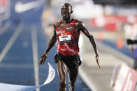 Lopez Lomong reacts as he wins the men's 10,000-meter run at the U.S. Championships athletics meet, Thursday, July 25, 2019, in Des Moines, Iowa. (AP Photo/Charlie Neibergall)