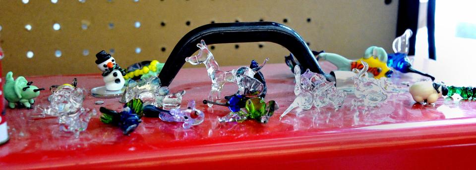 An assortment of small glass items made using the glassblowing torch in Smithville art classes.