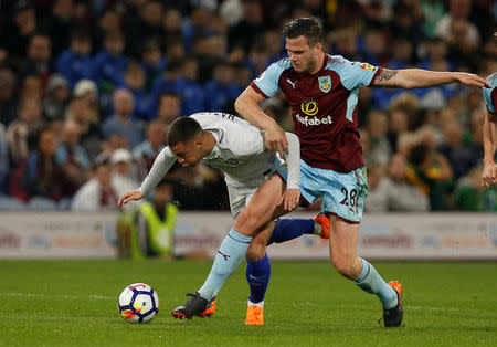 Soccer Football - Premier League - Burnley vs Chelsea - Turf Moor, Burnley, Britain - April 19, 2018 Chelsea's Eden Hazard in action with Burnley's Kevin Long REUTERS/Andrew Yates