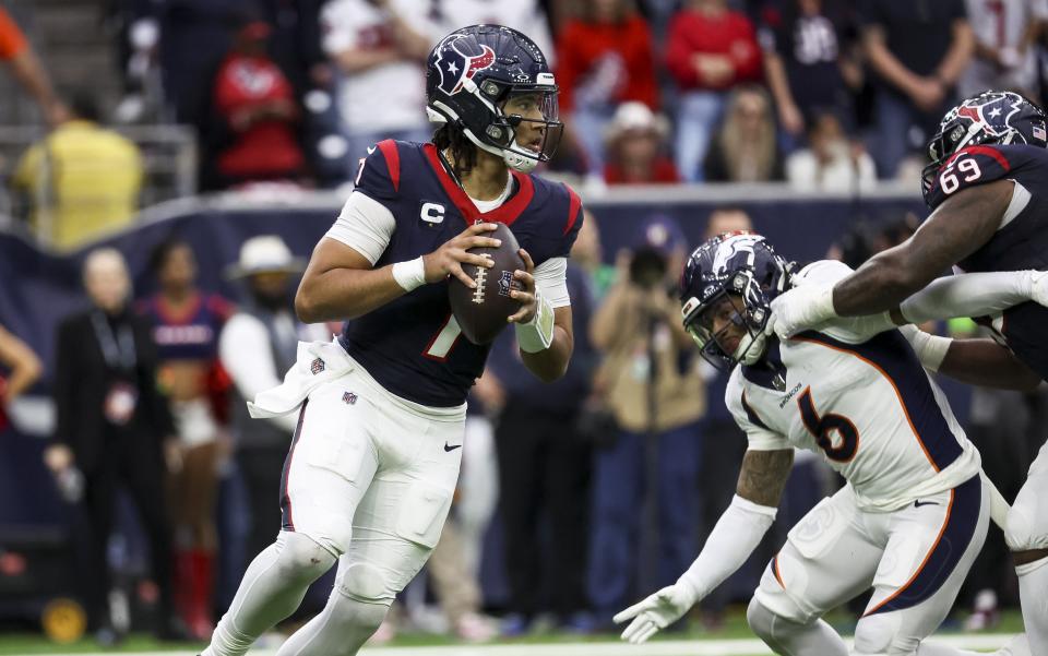 Dec 3, 2023; Houston, Texas, USA; Houston Texans quarterback <a class="link " href="https://sports.yahoo.com/nfl/players/40030" data-i13n="sec:content-canvas;subsec:anchor_text;elm:context_link" data-ylk="slk:C.J. Stroud;sec:content-canvas;subsec:anchor_text;elm:context_link;itc:0">C.J. Stroud</a> (7) rolls out of the pocket on a play during the fourth quarter against the Denver Broncos at NRG Stadium. Mandatory Credit: Troy Taormina-USA TODAY Sports