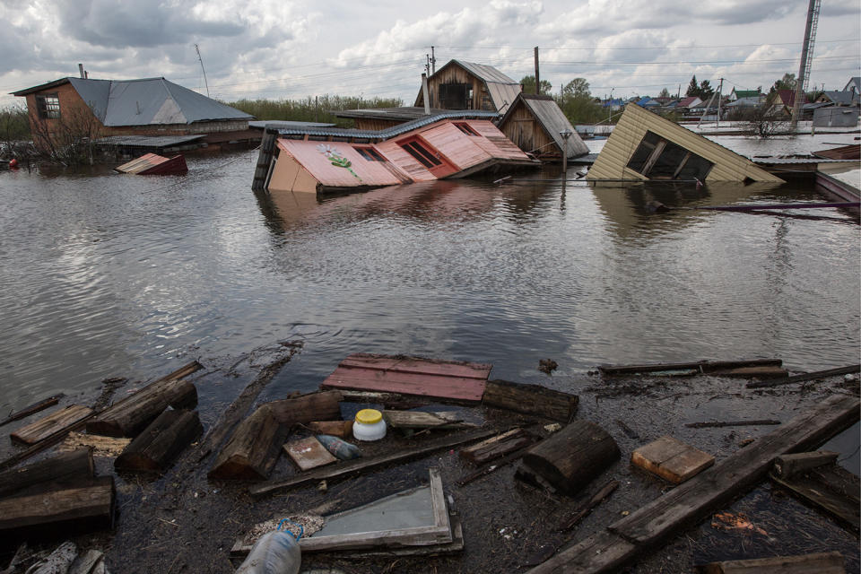 <p>Destroyed houses in the town of Ishim, Tyumen Region. According to the Tyumen Region Branch of the Russian Emergency Situations Ministry 5934 summer houses and 53 residential houses are flooded in the town of Ishim, 674 summer houses and 77 residential houses are flooded in the Ishim District. (Photo: Dmitry FeoktistovTASS via Getty Images) </p>