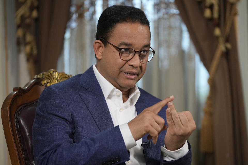 Presidential candidate Anies Baswedan gestures as he speaks during an interview with The Associated Press on the sidelines of his campaign rally in Bandar Lampung Timur, Indonesia, Sunday, Jan. 14, 2024. The former Jakarta governor seeking Indonesia's presidency said democracy is declining in the country and pledged to make changes to get it back on track. (AP Photo/Achmad Ibrahim)