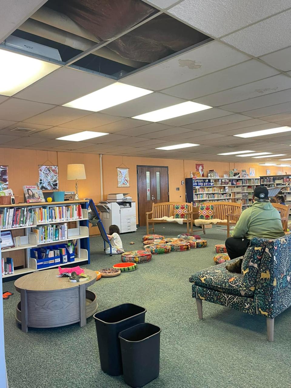 Trash receptacles are situated beneath an open drop ceiling in the kids area of the St. Clair County Library System's main Port Huron branch earlier this year. The county board of commissioners has signed off on using American Rescue Plan dollars to start engineering for a new roof.