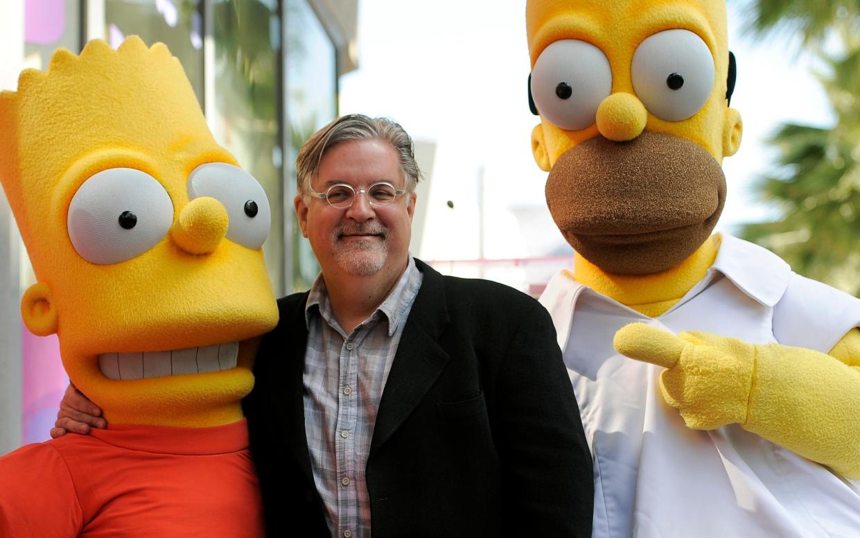 Matt Groening poses alongside two of his most famous creations in 2012 - AP/Chris Pizzello, File