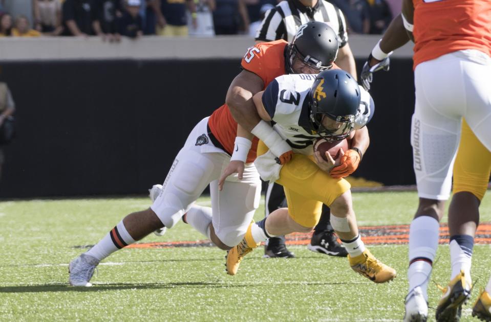 West Virginia had three turnovers. Oklahoma State had none. (Getty)