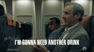 A person saying "I'm gonna need a drink" on a plane
