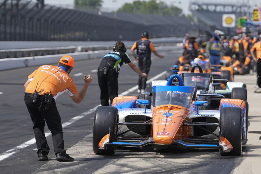 Scott Dixon, of New Zealand, leaves the pits during practice for the Indianapolis 500.