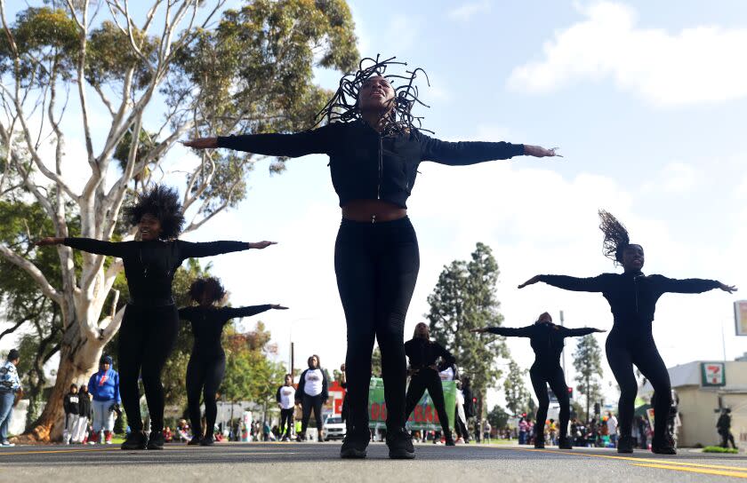 LOS ANGELES-CA-JANUARY 16, 2023: Princess Isis Lange, the founder and president of The Cardinal Divas of SC, the first majorette team at USC, center, participate in the 38th Annual Kingdom Day Parade in Leimert Park on Monday, January 16, 2023. (Christina House / Los Angeles Times)