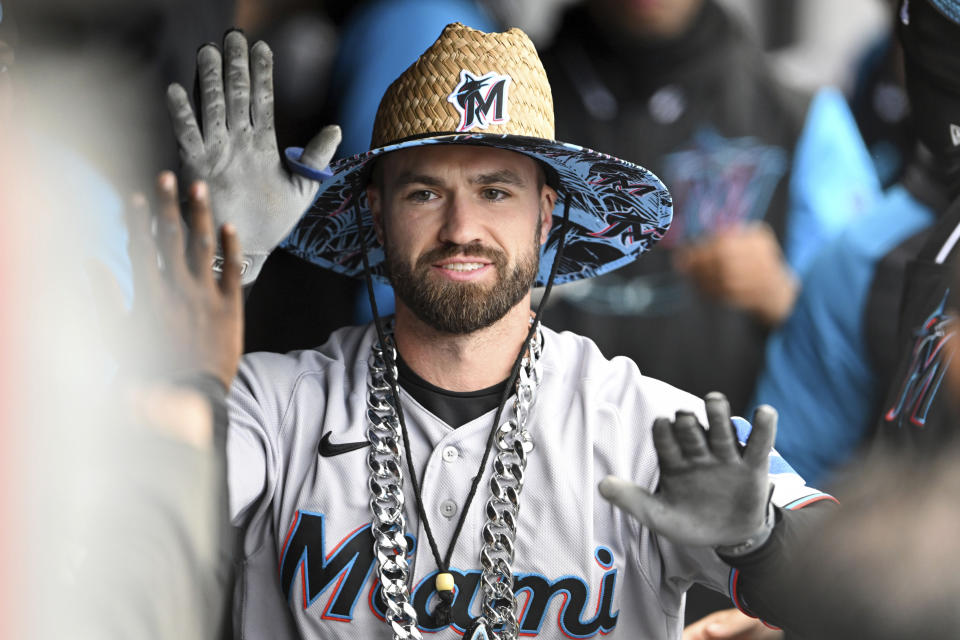 Miami Marlins' Jon Berti celebrates with teammates after hitting a solo home run off Cleveland Guardians starting pitcher Logan Allen during the third inning of a baseball game, Sunday, April 23, 2023, in Cleveland. (AP Photo/Nick Cammett)