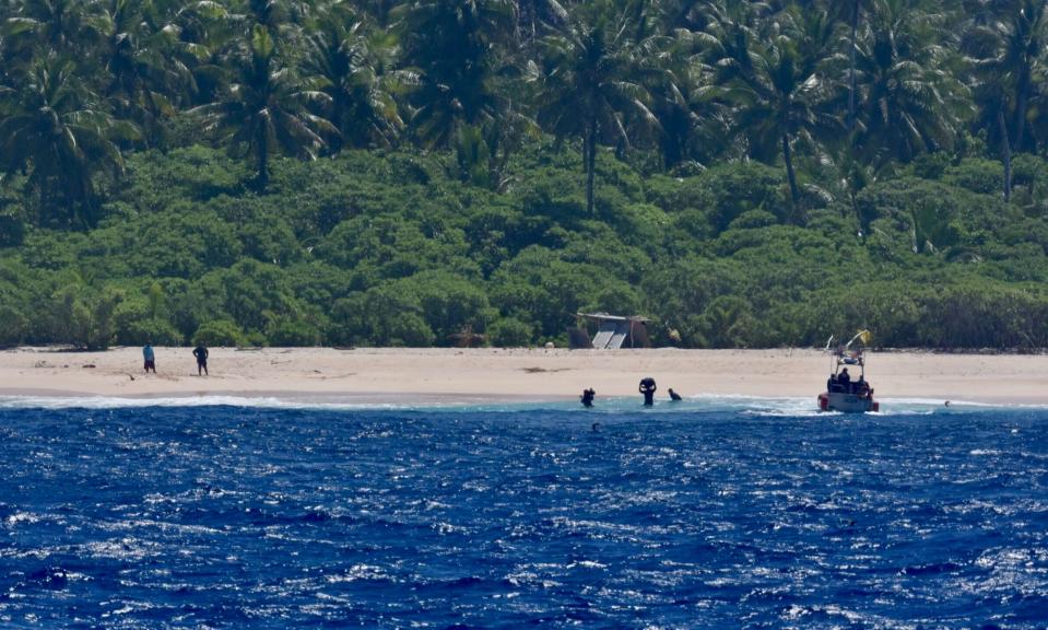 The crew of USCGC Oliver Henry make contact with three mariners stranded on Pikelot Atoll, Yap State, Federated States of Micronesia, on April 9, 2024.